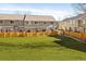Large, well maintained backyard with a full wooden fence and green grass at 9150 Gale Blvd # 1, Thornton, CO 80260