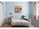 Bright bedroom with a sofa, side table, and window with plenty of natural light at 9150 Gale Blvd # 1, Thornton, CO 80260