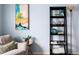 Bright room featuring cozy sitting chair, side table with plant, and ladder shelf for decor at 9150 Gale Blvd # 1, Thornton, CO 80260