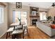 Comfortable living area with hardwood flooring, a fireplace, and sliding door access to outdoor space at 9150 Gale Blvd # 1, Thornton, CO 80260