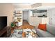 Cozy open-concept living room with hardwood floors, stylish decor, and an adjacent kitchen area at 9150 Gale Blvd # 1, Thornton, CO 80260