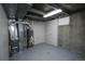 Unfinished basement with mechanicals and laundry hookups at 5539 Atchison St, Denver, CO 80239