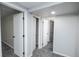 Neutral hallway features carpet floors and access to bathroom and bedroom at 5539 Atchison St, Denver, CO 80239