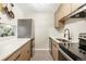 Modern kitchen with stainless steel appliances and sleek countertops at 2 Adams Street # 108, Denver, CO 80206