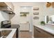 Well-lit kitchen with modern appliances and convenient storage solutions at 2 Adams Street # 108, Denver, CO 80206