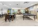 Spacious recreation room with dining area, living space, and a ping pong table for entertainment at 2 Adams Street # 108, Denver, CO 80206