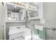 Bathroom featuring decorative lighting, white vanity and green and white hand towel at 2101 S Josephine St # 202, Denver, CO 80210