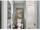 This bathroom features a shower and toilet with shelf for decor above at 2101 S Josephine St # 202, Denver, CO 80210
