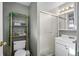 This bathroom features a shower and toilet with shelf for decor above at 2101 S Josephine St # 202, Denver, CO 80210