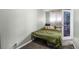 Bedroom featuring window with curtains, a bed, pillows and carpet at 2101 S Josephine St # 202, Denver, CO 80210