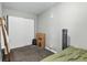 Bedroom featuring carpet flooring, closet with mirror doors and fan at 2101 S Josephine St # 202, Denver, CO 80210