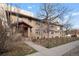 Inviting multi-Gathering building featuring a brick facade, well-maintained landscaping, and a charming entryway at 2101 S Josephine St # 202, Denver, CO 80210