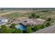 An aerial view of community amenities including a pool, clubhouse, basketball court, and ample parking at 10449 Paris St # 207, Commerce City, CO 80640