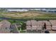 An aerial view showcasing the townhome community, highlighting its proximity to water and open space at 10449 Paris St # 207, Commerce City, CO 80640