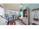 Inviting breakfast nook with a cozy round table, chairs, and natural light from a large window at 10449 Paris St # 207, Commerce City, CO 80640