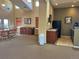 Cozy community room with comfortable seating, kitchenette, and plenty of natural light at 10449 Paris St # 207, Commerce City, CO 80640