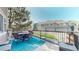 View of the deck with outdoor seating and a glimpse of the surrounding neighborhood at 10449 Paris St # 207, Commerce City, CO 80640