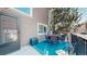 Outdoor deck furnished with a dining table and chairs, perfect for entertaining at 10449 Paris St # 207, Commerce City, CO 80640