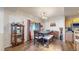 Warm dining area with wood floors, plenty of light, and enough space to entertain guests at 10449 Paris St # 207, Commerce City, CO 80640