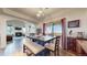 Bright dining area boasts hardwood floors, scenic views, and an open layout for easy entertaining at 10449 Paris St # 207, Commerce City, CO 80640