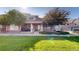 Charming two-story home with a well-manicured lawn and inviting front porch at 10449 Paris St # 207, Commerce City, CO 80640