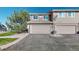 Exterior shot of a home featuring a two-car garage with a paved driveway at 10449 Paris St # 207, Commerce City, CO 80640