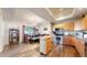 Kitchen with stainless steel appliances, wood flooring and island with room for seating at 10449 Paris St # 207, Commerce City, CO 80640