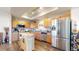 Efficient kitchen with stainless appliances, ample cabinet space, and a functional center island at 10449 Paris St # 207, Commerce City, CO 80640