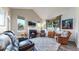 Inviting living room features vaulted ceiling, fireplace and two large windows at 10449 Paris St # 207, Commerce City, CO 80640