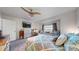 Spacious main bedroom with a built-in window seat and television, offering comfort and entertainment at 10449 Paris St # 207, Commerce City, CO 80640