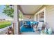 Inviting covered front porch with comfortable seating and decor at 10449 Paris St # 207, Commerce City, CO 80640