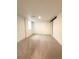 Bright basement featuring neutral carpet, white walls, and a sliding barn door at 3355 Moorhead Ave, Boulder, CO 80305