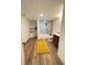 Finished basement bathroom with shower and cabinet and bright yellow rug at 3355 Moorhead Ave, Boulder, CO 80305