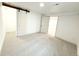 Neutral basement featuring carpet, white walls, and two bright doors at 3355 Moorhead Ave, Boulder, CO 80305