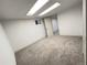 Finished basement features neutral carpet, recessed lighting, and white walls at 3355 Moorhead Ave, Boulder, CO 80305