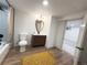 Updated bathroom with tiled shower, vanity, and bright light fixture at 3355 Moorhead Ave, Boulder, CO 80305