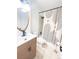Stylish bathroom with modern vanity, oval mirror, and unique shower curtain at 3355 Moorhead Ave, Boulder, CO 80305