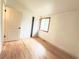 Cozy bedroom with light-colored walls and hardwood floors at 3355 Moorhead Ave, Boulder, CO 80305