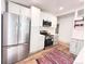 Modern kitchen with stainless steel appliances, white cabinetry, and stylish backsplash at 3355 Moorhead Ave, Boulder, CO 80305