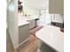 A bright kitchen featuring white countertops and cabinetry and stainless steel appliances at 3355 Moorhead Ave, Boulder, CO 80305