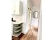 Bright kitchen hallway area with white cabinets and wood floors at 3355 Moorhead Ave, Boulder, CO 80305