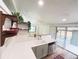 Spacious kitchen featuring white countertops and cabinetry, and access to the outdoor patio at 3355 Moorhead Ave, Boulder, CO 80305