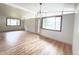 Inviting living room with abundant natural light and beautiful hardwood floors at 3355 Moorhead Ave, Boulder, CO 80305