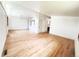 Bright living room featuring hardwood floors, large windows, and a modern aesthetic at 3355 Moorhead Ave, Boulder, CO 80305