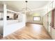 Open-concept living room with hardwood floors and a view into the kitchen at 3355 Moorhead Ave, Boulder, CO 80305