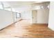 Spacious living room featuring hardwood floors, modern lighting, and many windows at 3355 Moorhead Ave, Boulder, CO 80305