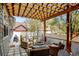 Inviting backyard patio with comfortable seating, a fire pit, and stylish pergola at 629 Jackson St, Lafayette, CO 80026