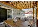 Stylish backyard patio with a dining table, cozy seating, and a covered pergola at 629 Jackson St, Lafayette, CO 80026
