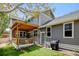 Charming backyard with a covered patio, artificial turf, and well-maintained landscaping at 629 Jackson St, Lafayette, CO 80026