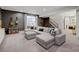 Basement featuring a large gray sofa and seating area, great for relaxing at 629 Jackson St, Lafayette, CO 80026